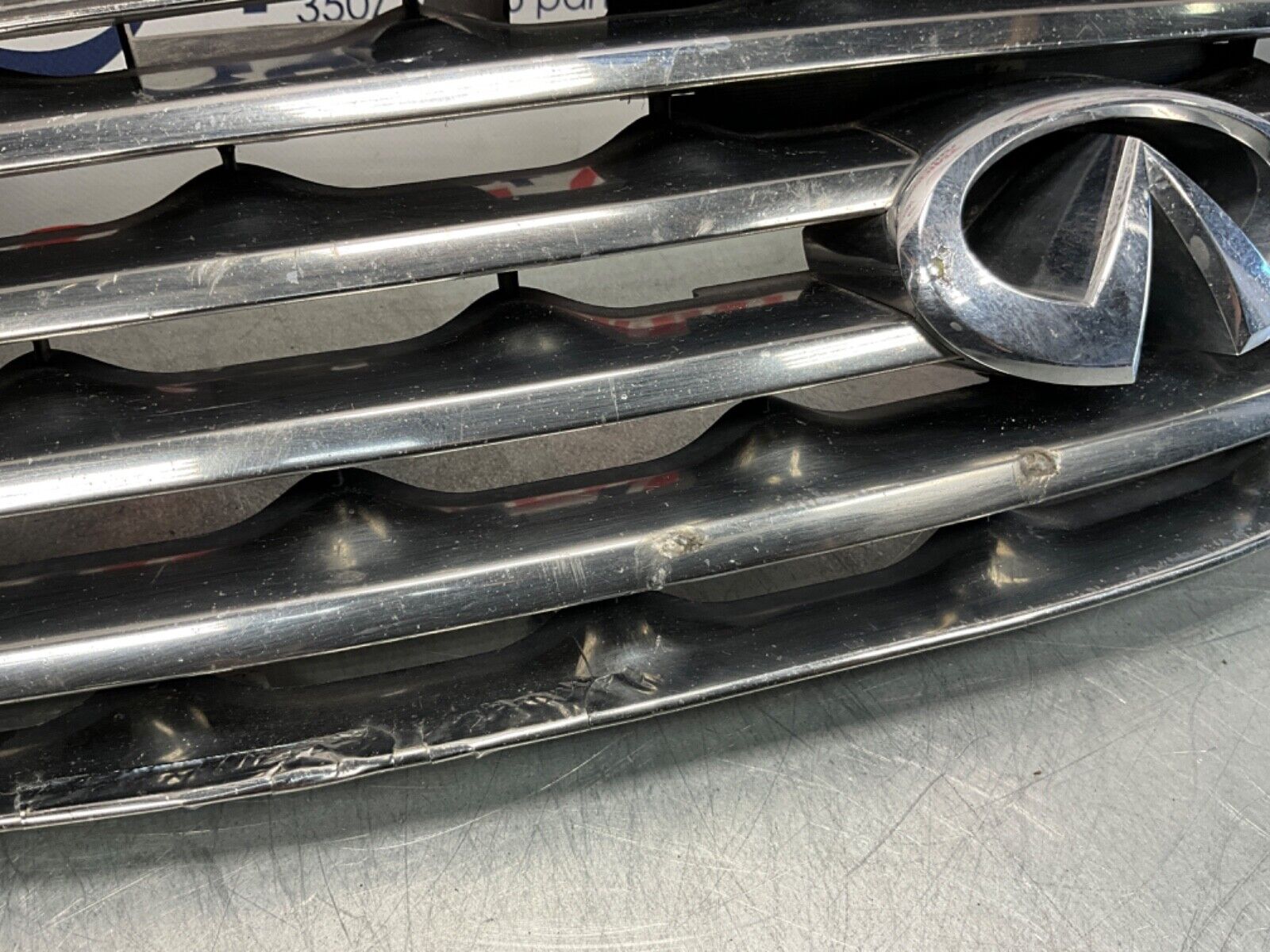 2005 Infiniti V35 G35 Coupe Front Bumper Grille with Emblem OEM 13BJXE2 - On Point Parts Inc