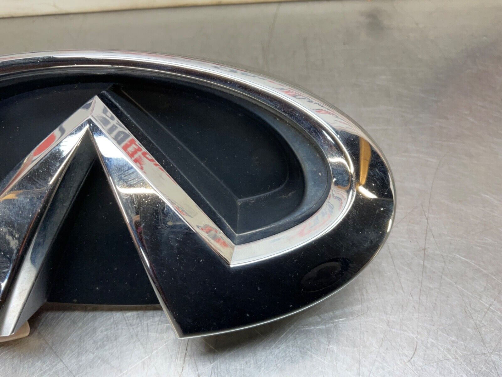 2009 Infiniti V36 G37 Front Grille Emblem  OEM 12BAWFC - On Point Parts Inc