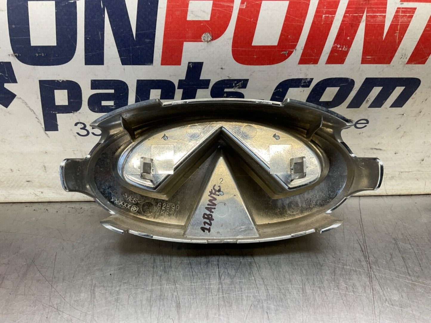 2009 Infiniti V36 G37 Front Grille Emblem  OEM 12BAWFC - On Point Parts Inc