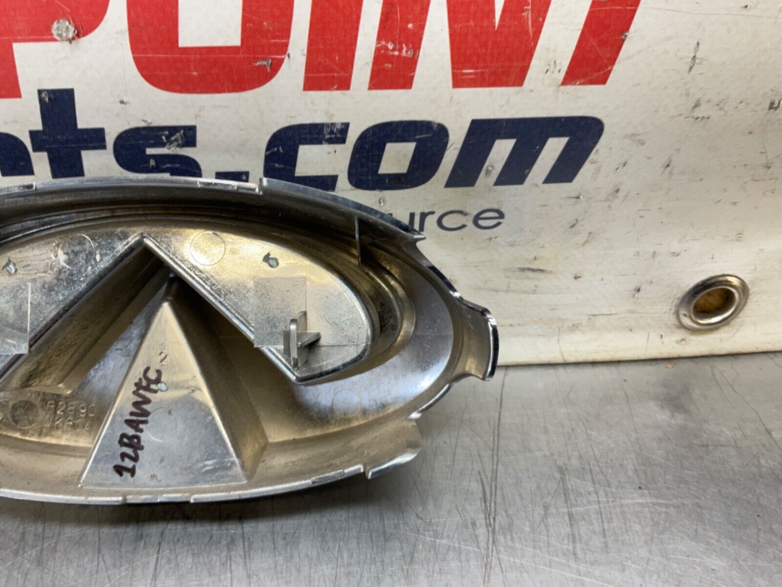 2009 Infiniti V36 G37 Front Grille Emblem  OEM 12BAWFC - On Point Parts Inc