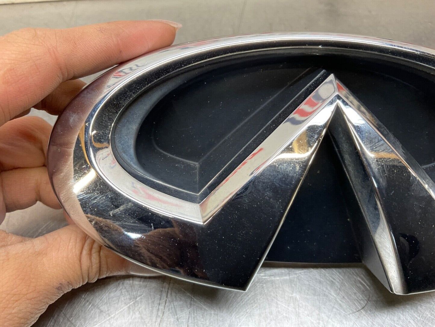 2009 Infiniti V36 G37 Front Grille Emblem  OEM 12BAWFC - On Point Parts Inc