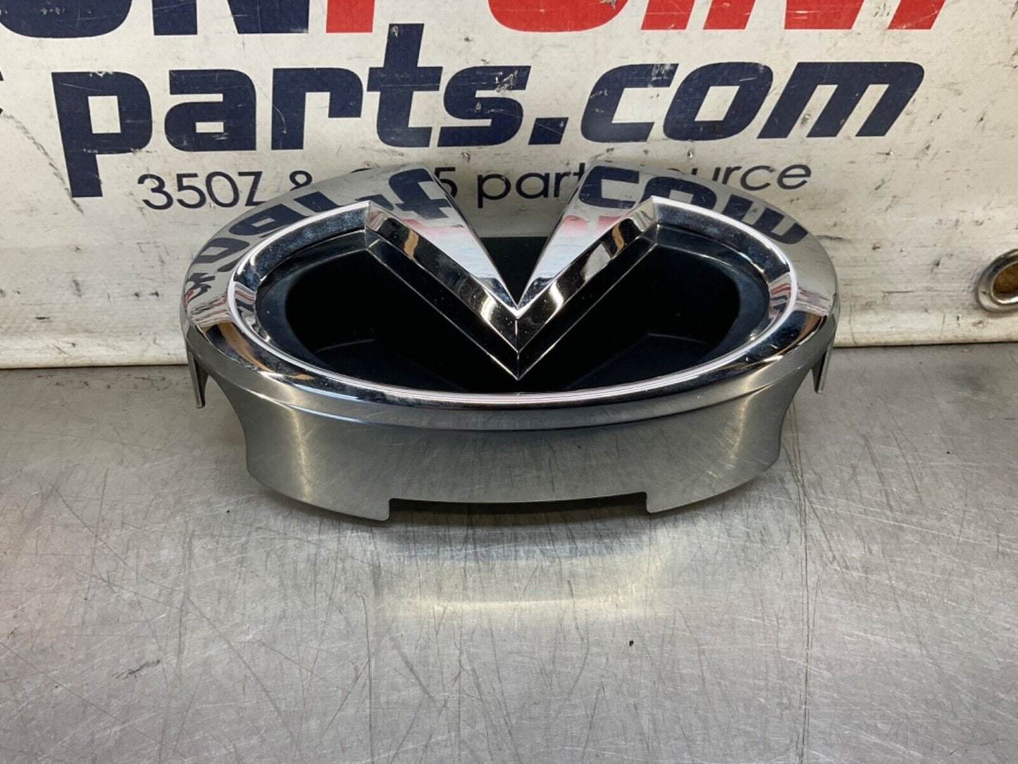 2009 Infiniti V36 G37 Front Grille Emblem  OEM 12BAWFC - On Point Parts Inc