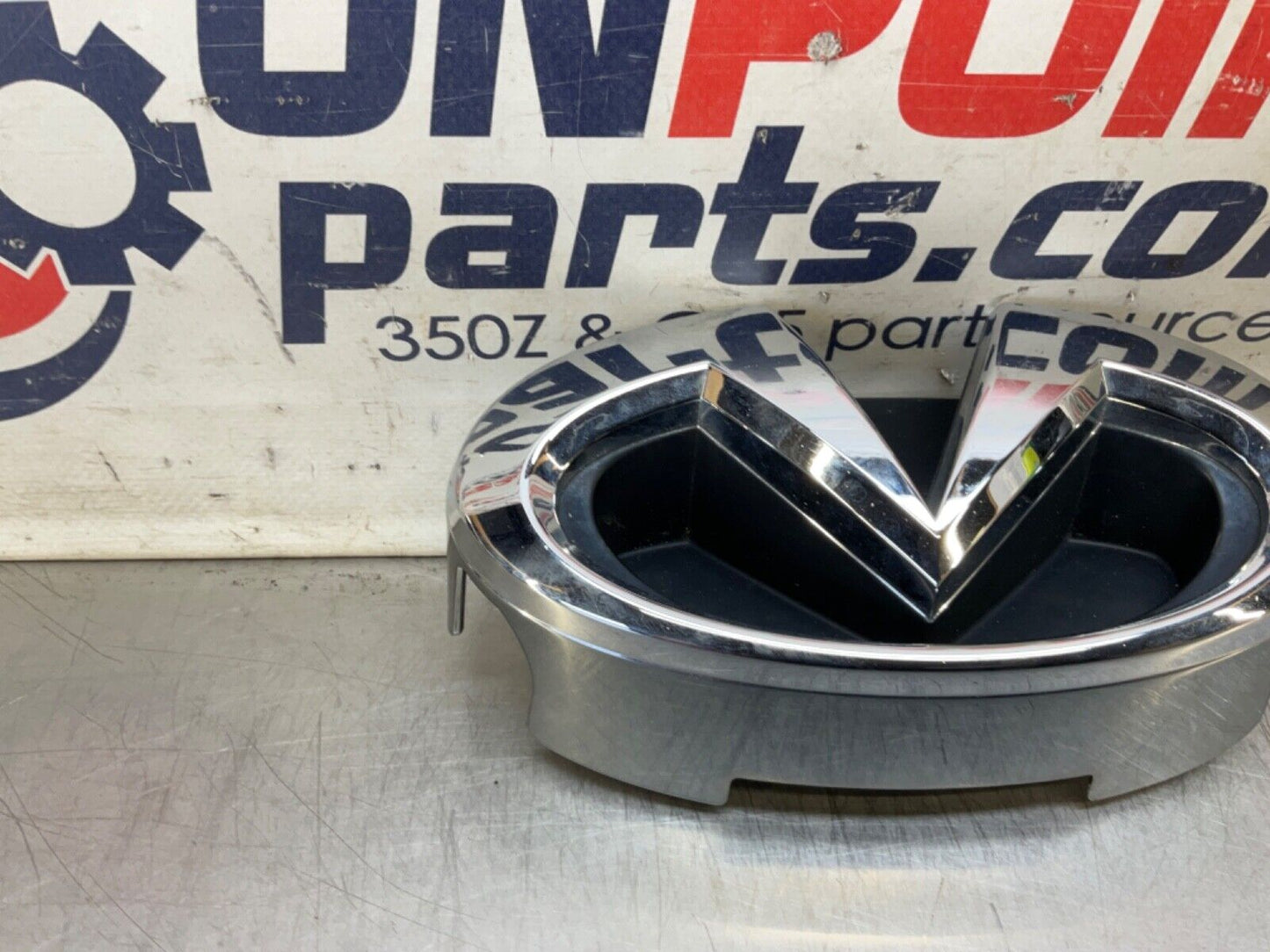 2009 Infiniti V36 G37 Front Grille Emblem  OEM 12BAWFC - On Point Parts Inc